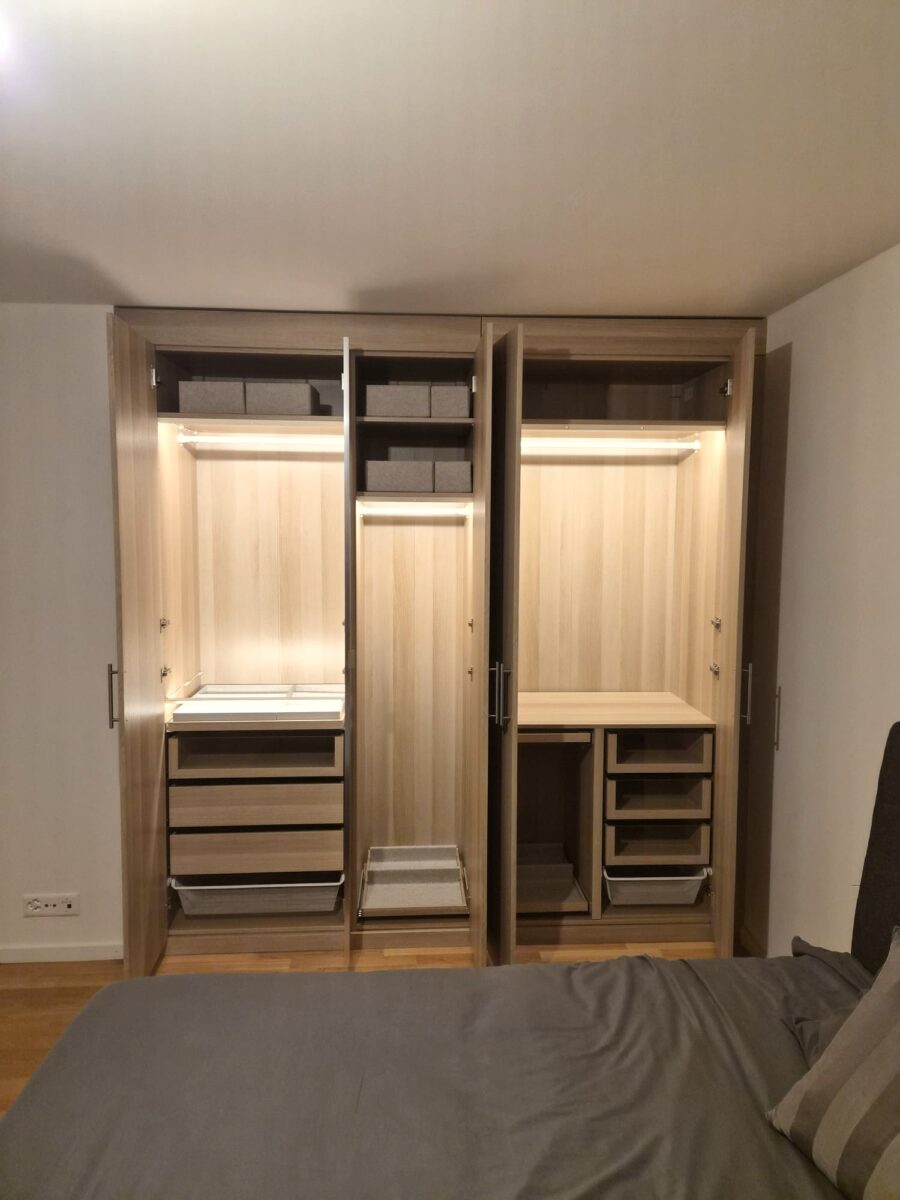 Lit wardrobe interior, drawers and hanging space