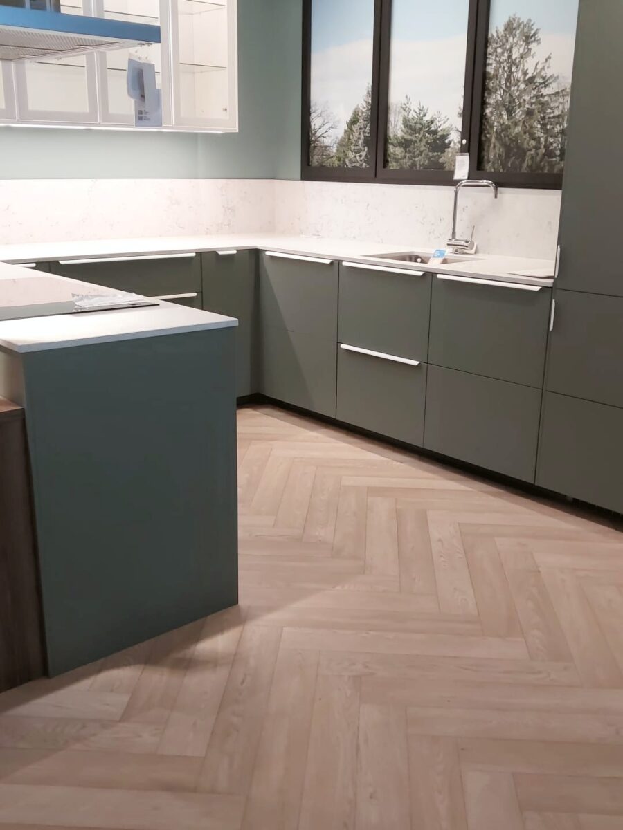 Verdigris L-shaped kitchen with return